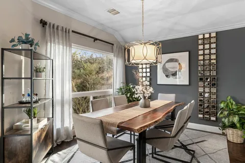 a kitchen with a stove a sink and a refrigerator