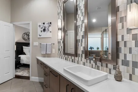 a bathroom with a shower and a sink