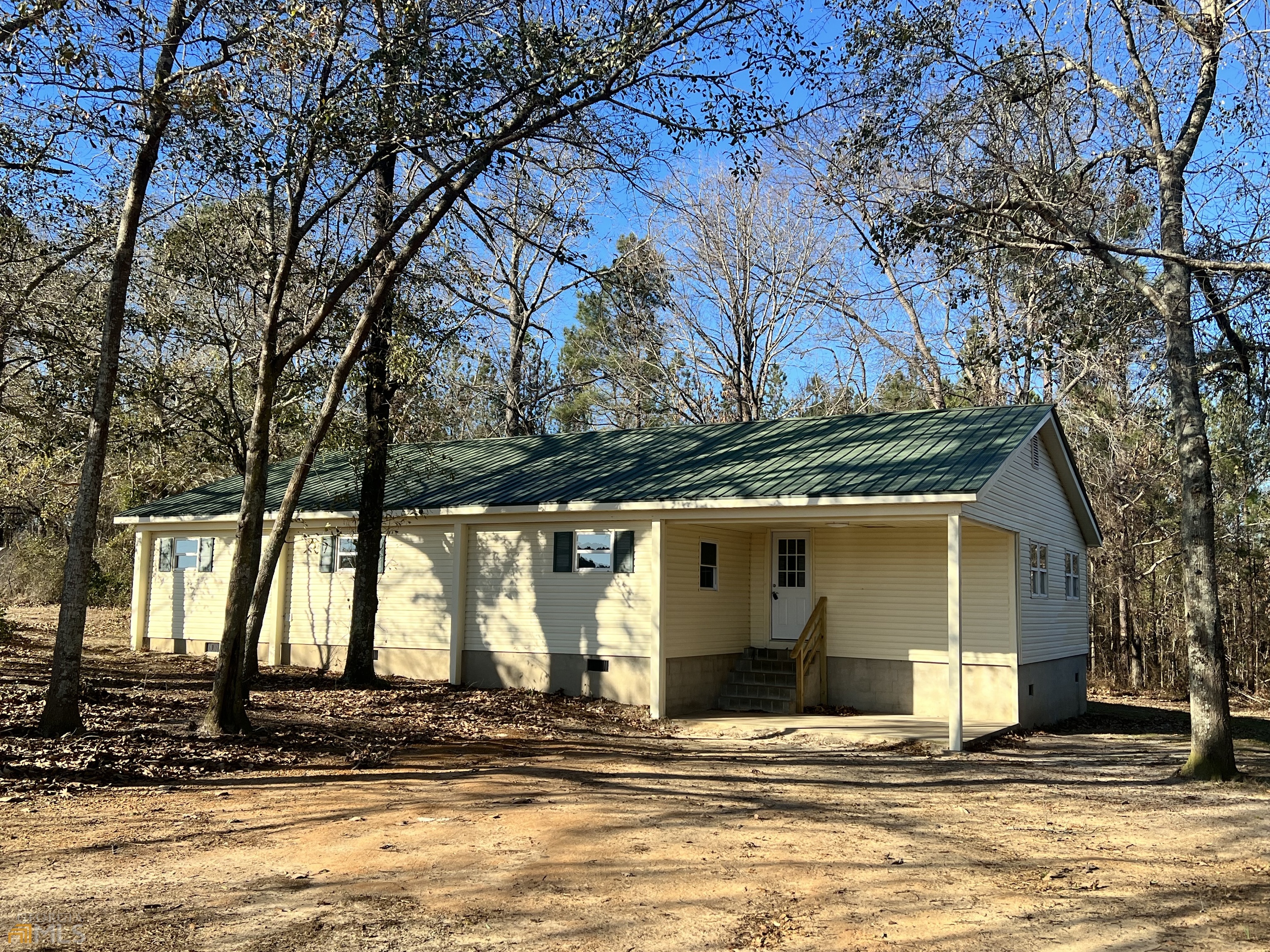 1139 County Line Road Southwest Gibson, GA 30810 - Photo 1 of 1 a view of a house with a yard