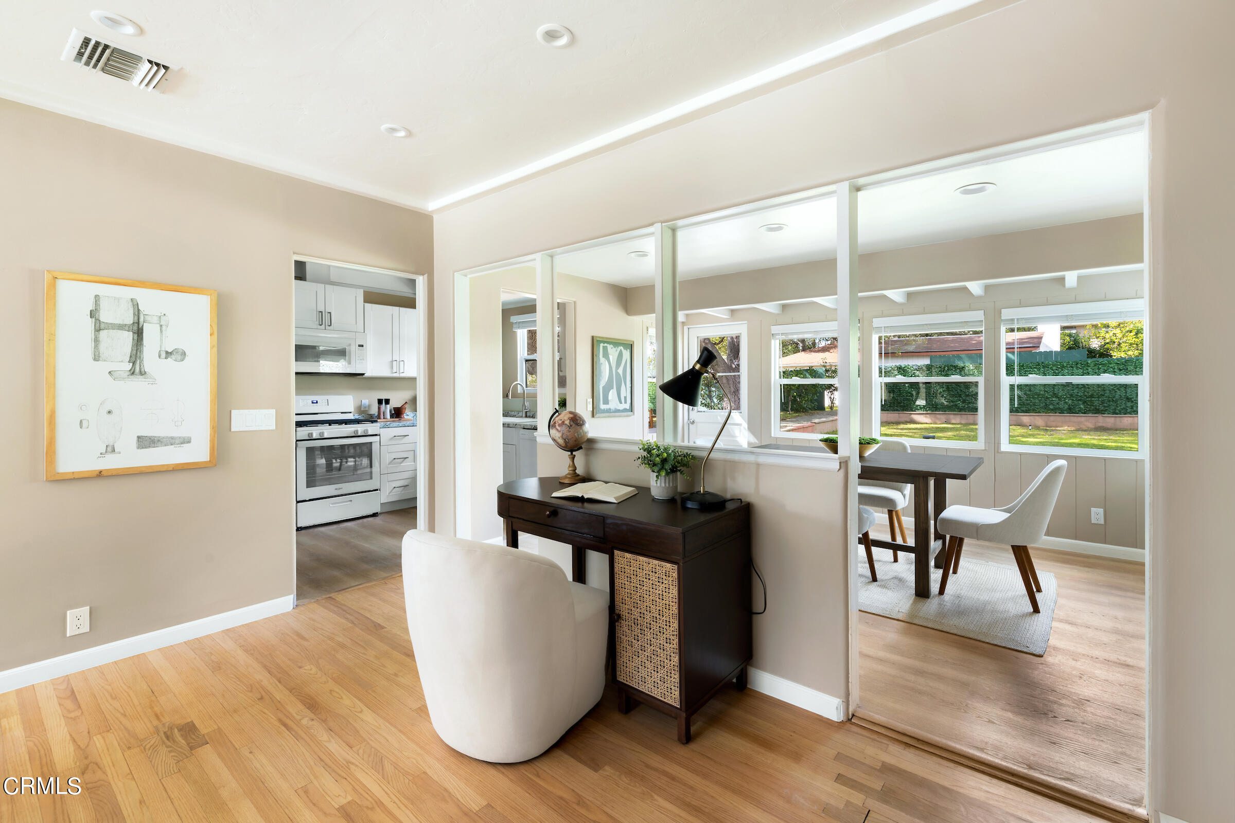 1673 Coolidge Avenue Altadena, CA 91001 - Photo 16 of 59 a living room with furniture a large window and wooden floor