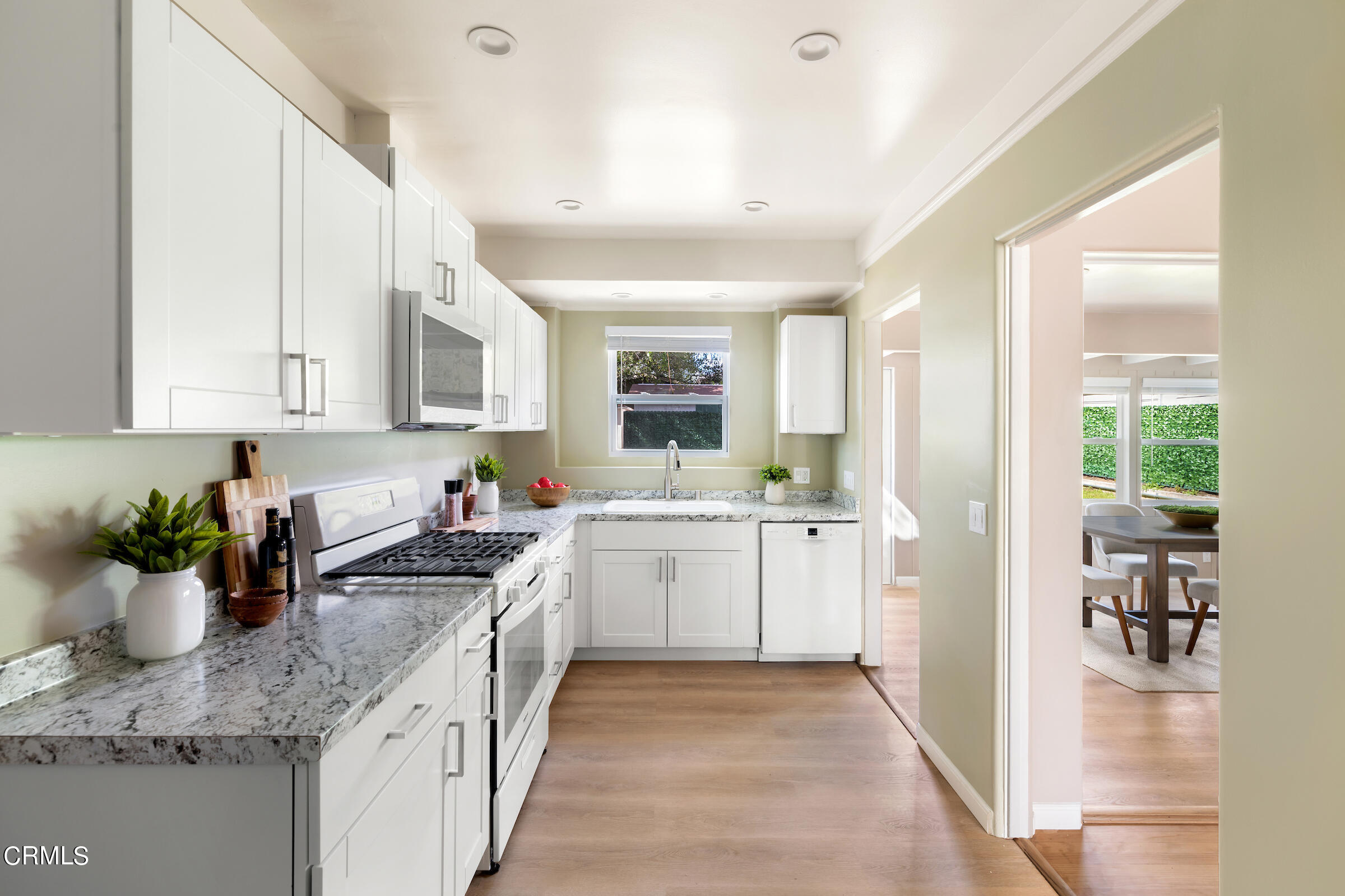 1673 Coolidge Avenue Altadena, CA 91001 - Photo 22 of 59 a kitchen with a sink stove and cabinets