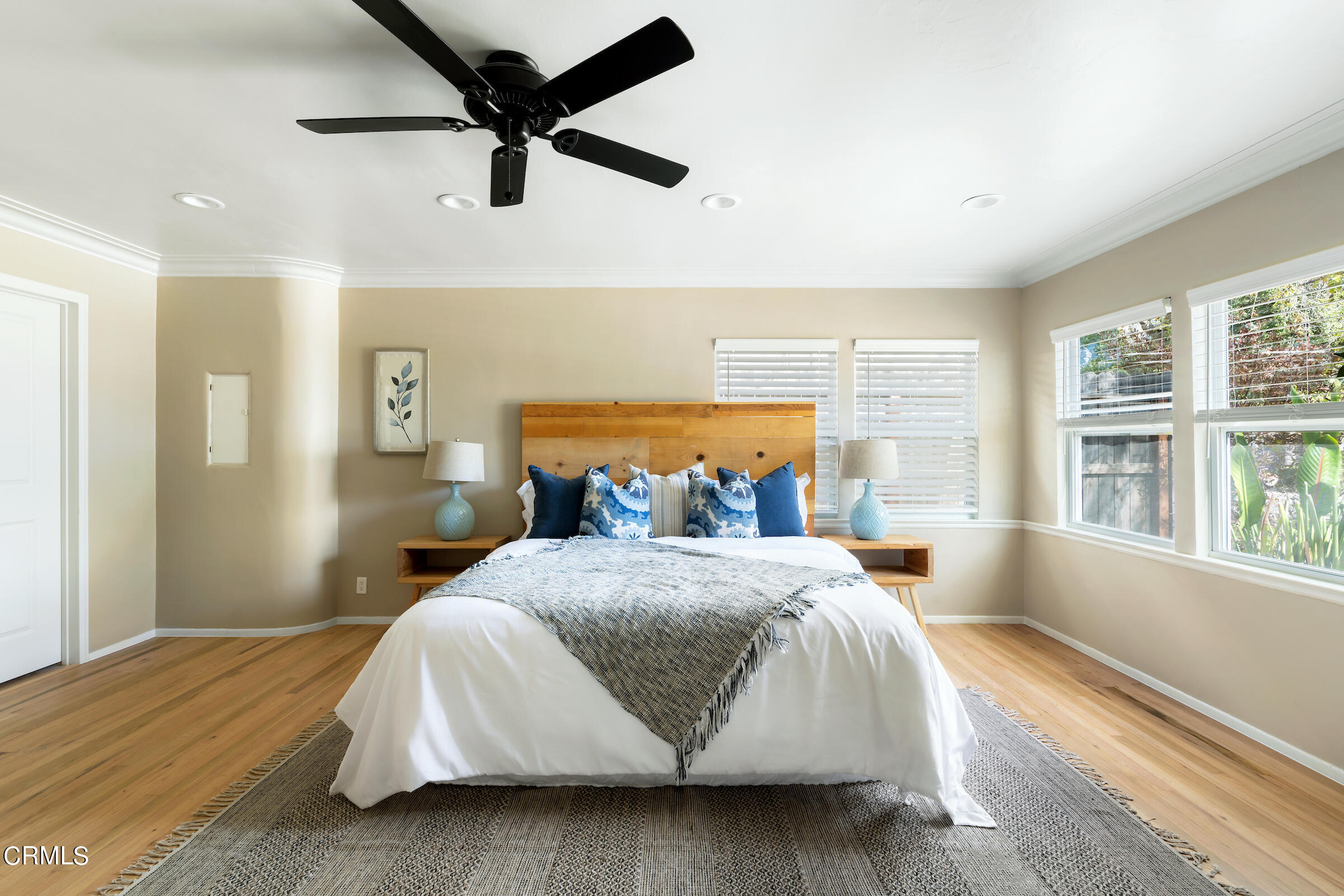 1673 Coolidge Avenue Altadena, CA 91001 - Photo 31 of 59 a bedroom with a bed a window and a chandelier