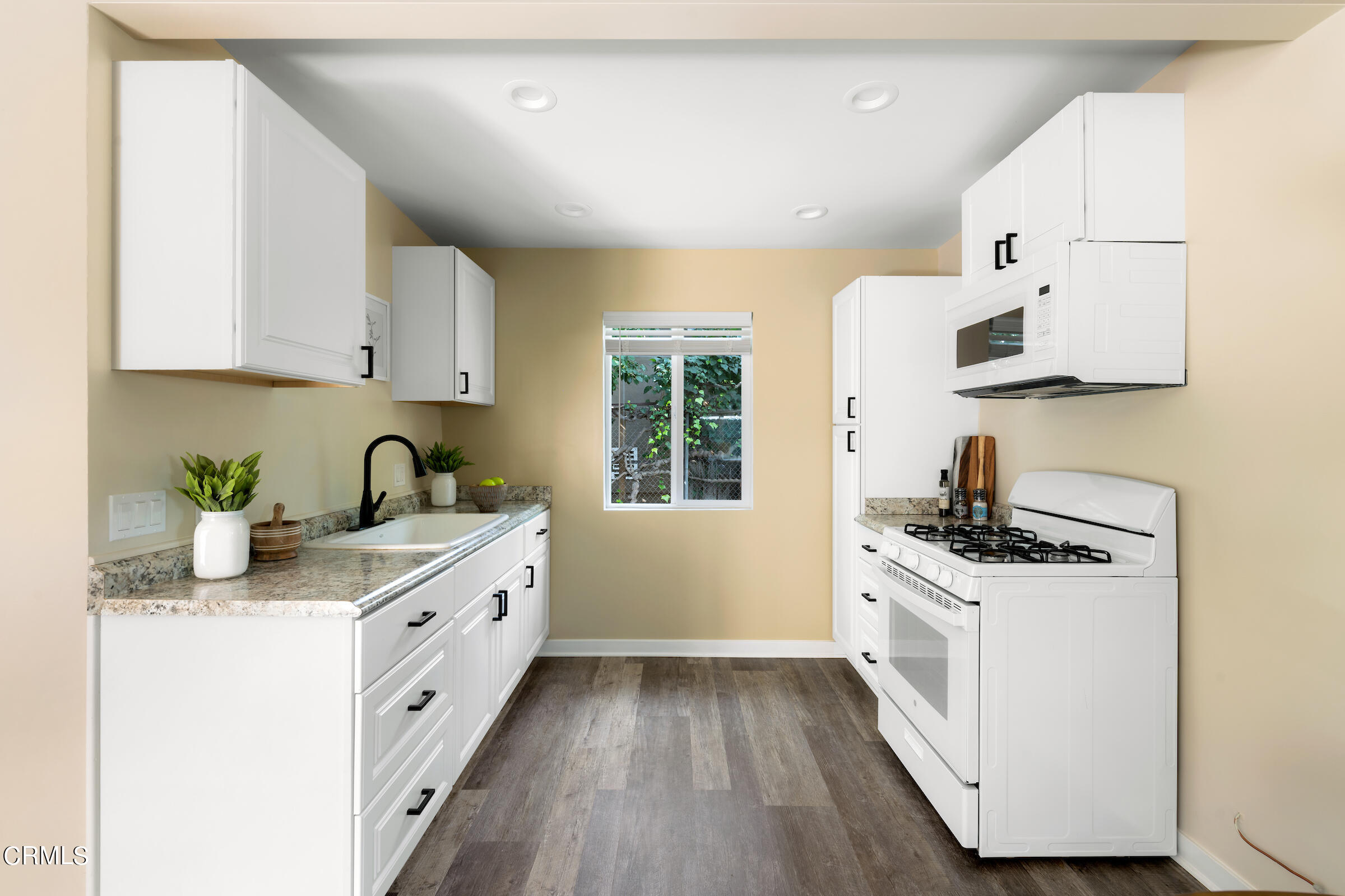 1673 Coolidge Avenue Altadena, CA 91001 - Photo 56 of 59 a kitchen with stainless steel appliances granite countertop a sink stove and cabinets
