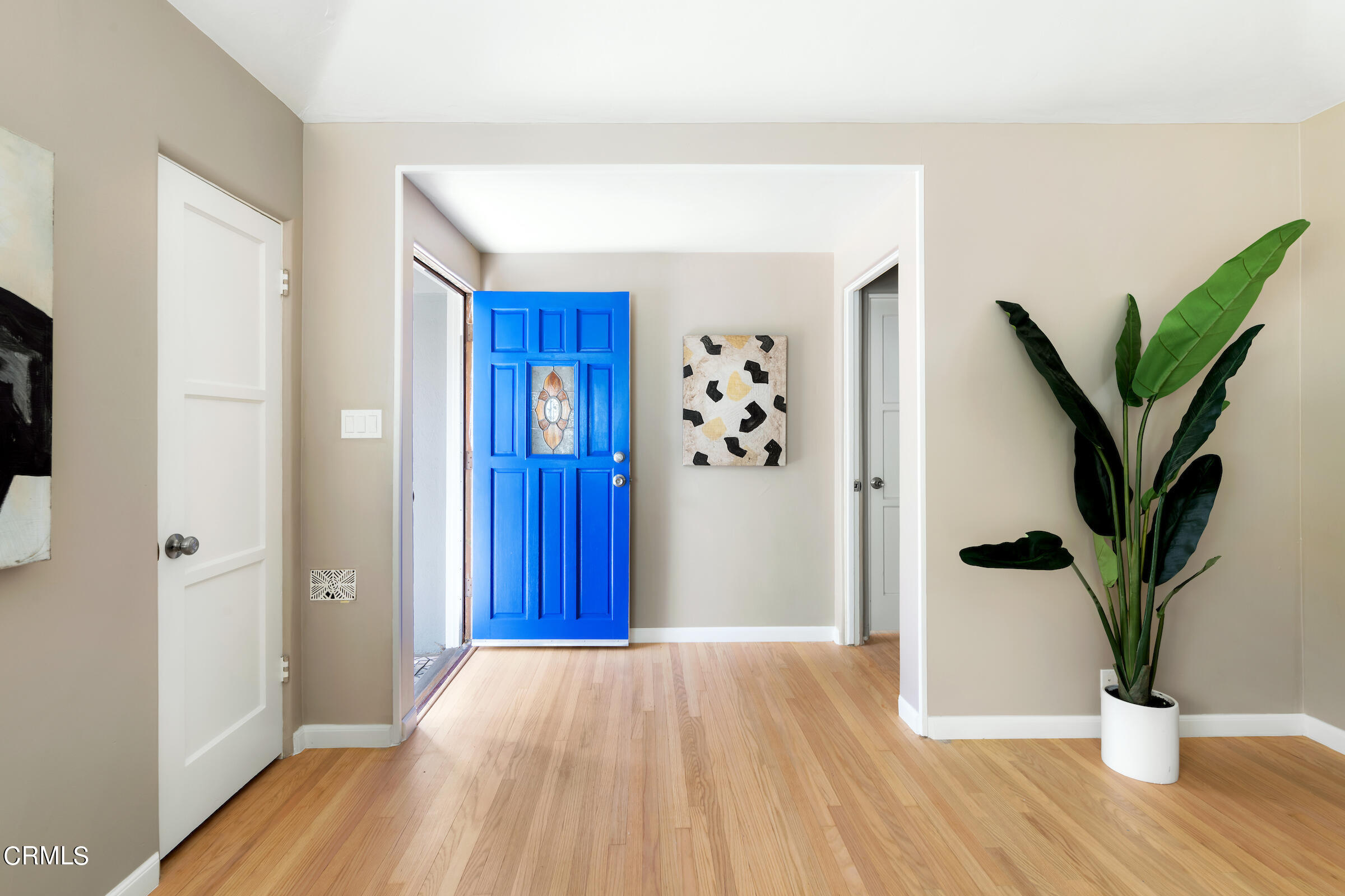 1673 Coolidge Avenue Altadena, CA 91001 - Photo 8 of 59 a view of a hallway with wooden floor and a bathroom