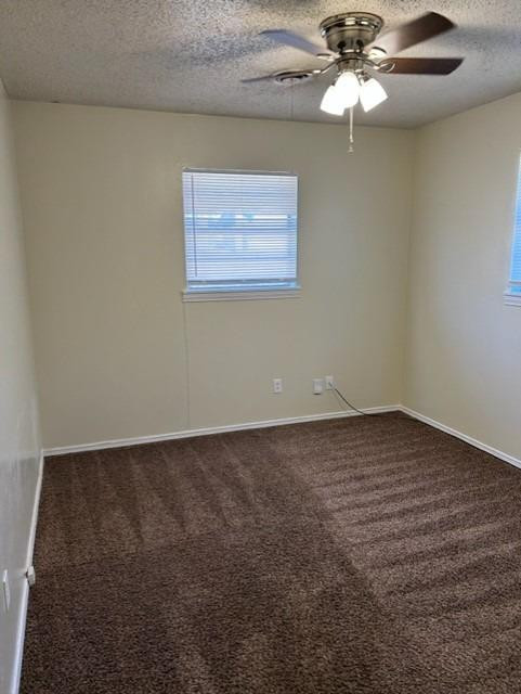 1636 58th Street, Unit B Lubbock, TX 79412 - Photo 5 of 8 a view of an empty room with a chandelier fan