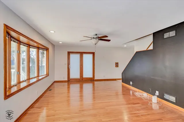 a view of an entryway with wooden floor