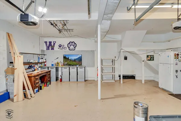 a view of a house with swimming pool and sitting area