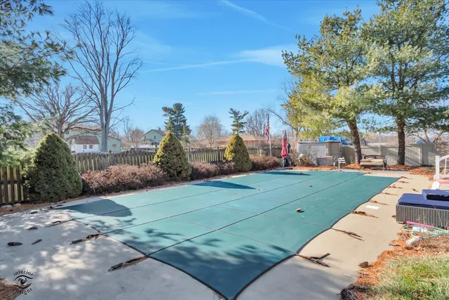 a view of a swimming pool and lounge chairs