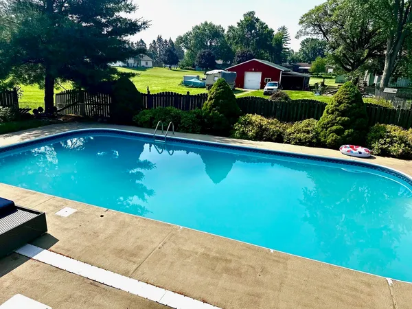 a view of outdoor space and swimming pool