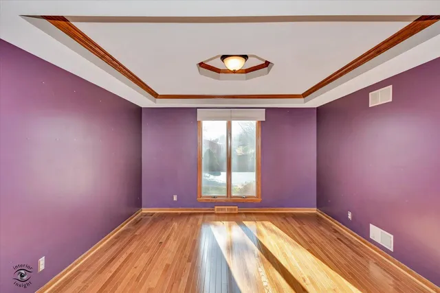 a view of empty room with a ceiling fan and window