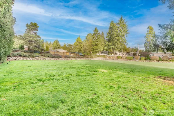 a view of a big yard with a house