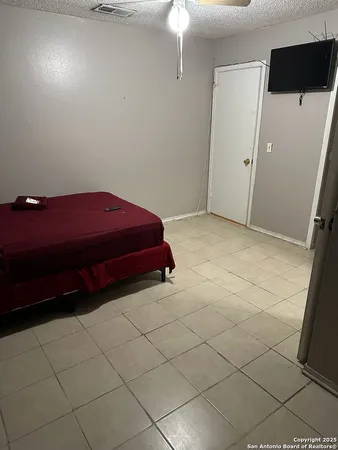 a room with a cabinet and a flat screen tv