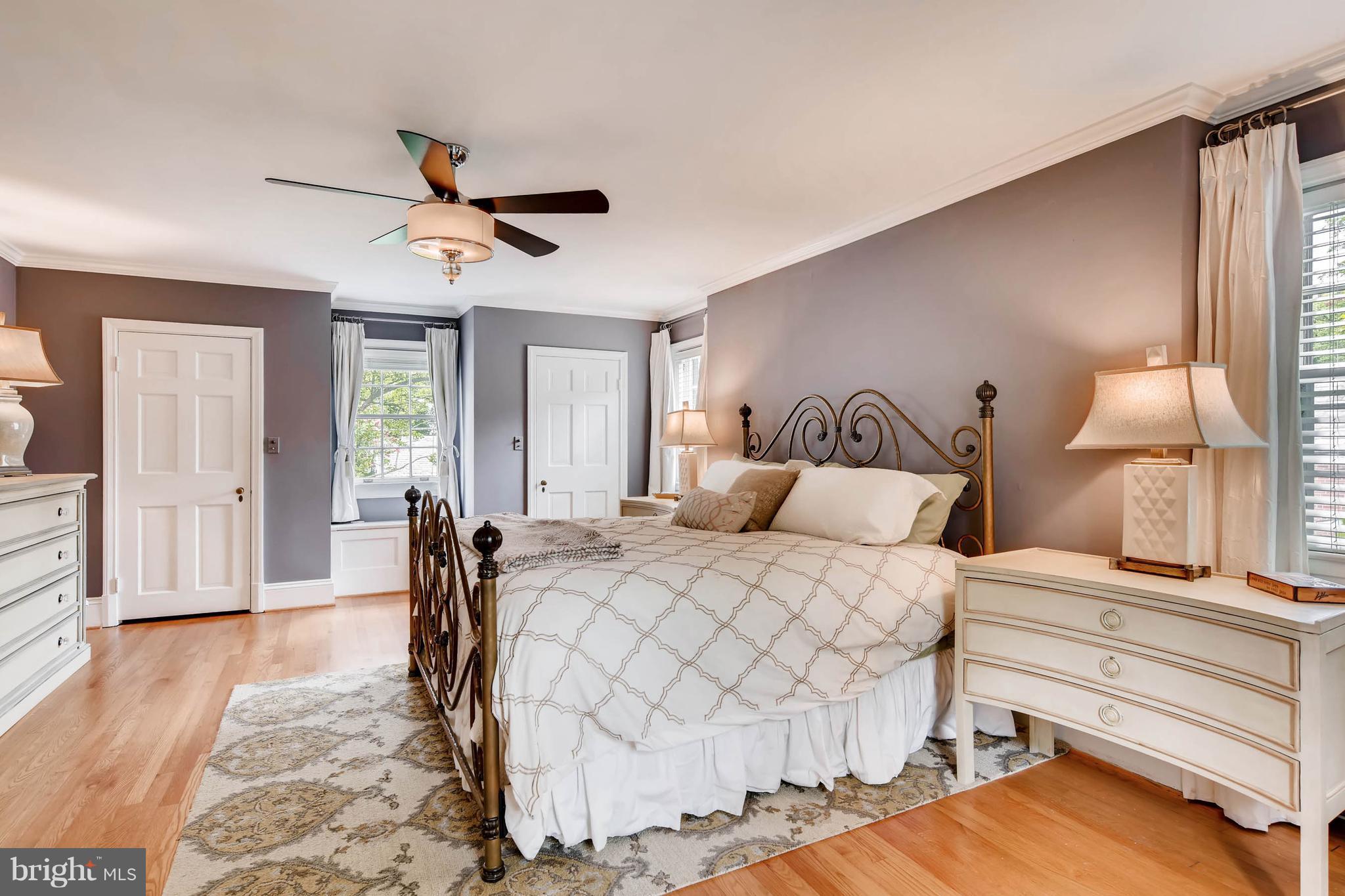 106 Enfield Road Baltimore, MD 21212 - Photo 13 of 27 a bedroom with a bed and wooden floor