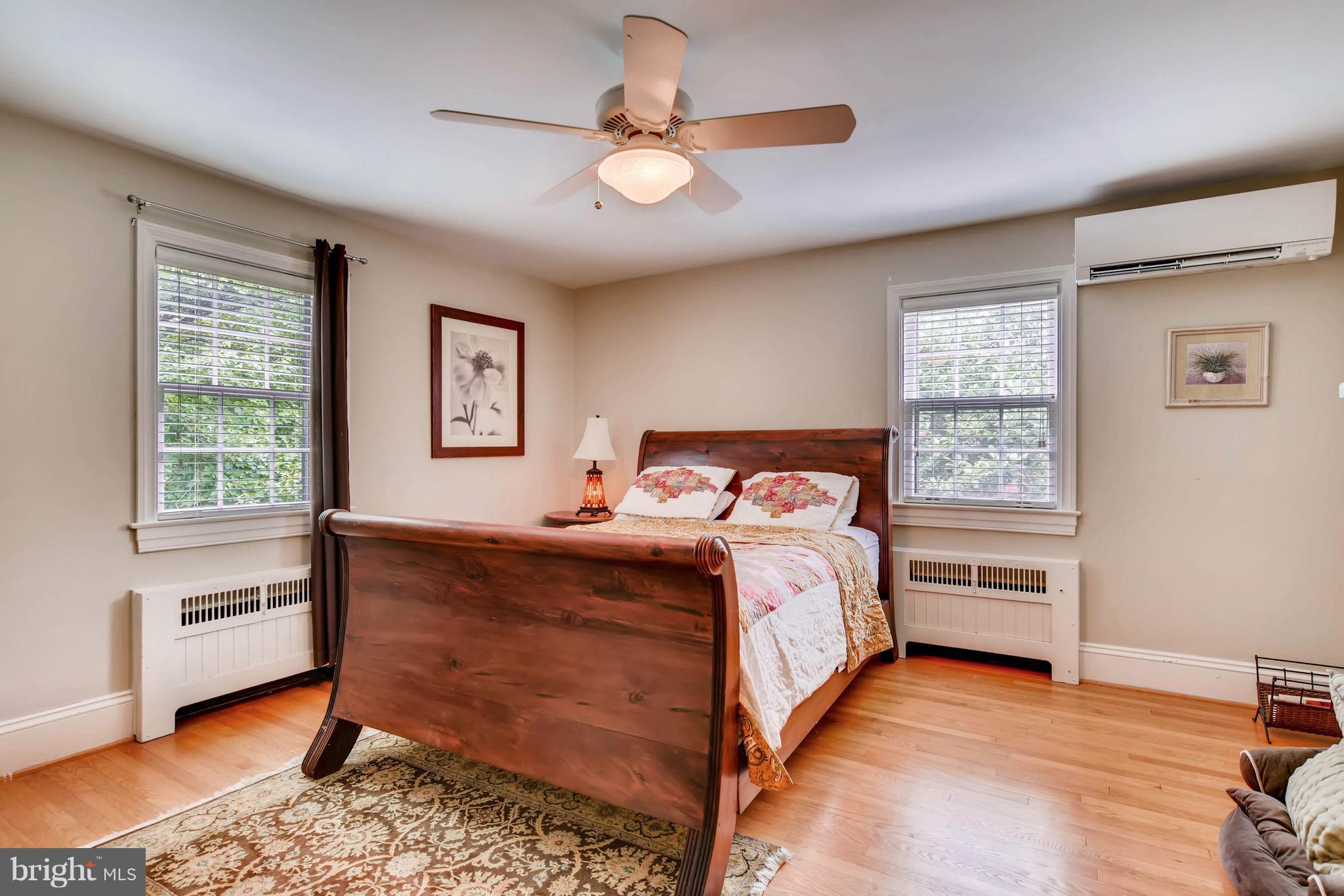 106 Enfield Road Baltimore, MD 21212 - Photo 19 of 27 a bedroom with a bed and a window