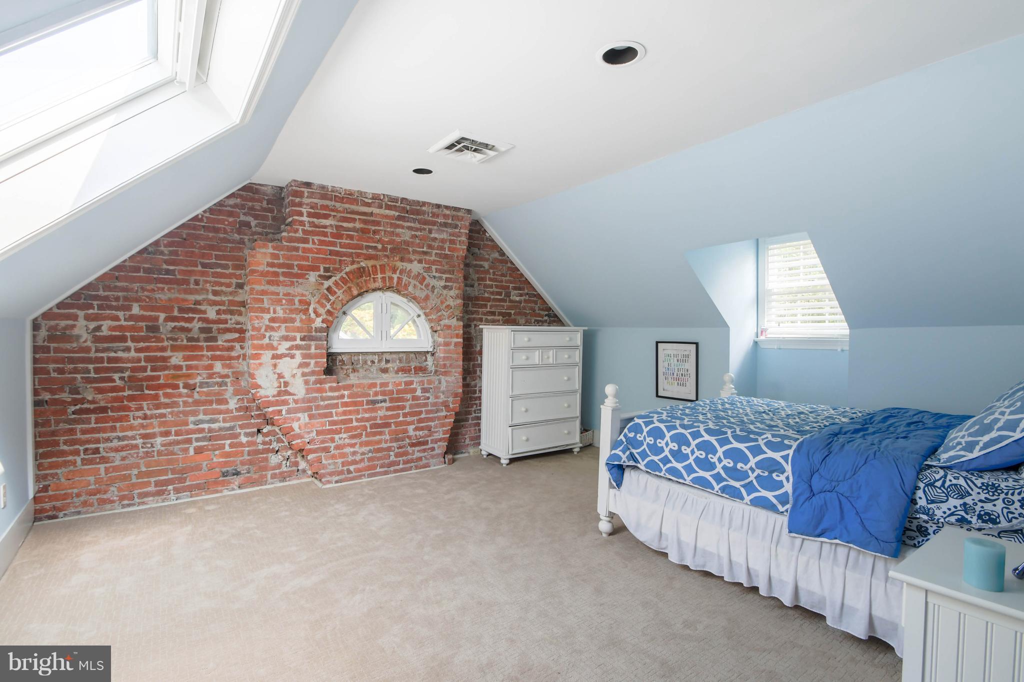106 Enfield Road Baltimore, MD 21212 - Photo 22 of 27 a bed room with a bed and a window