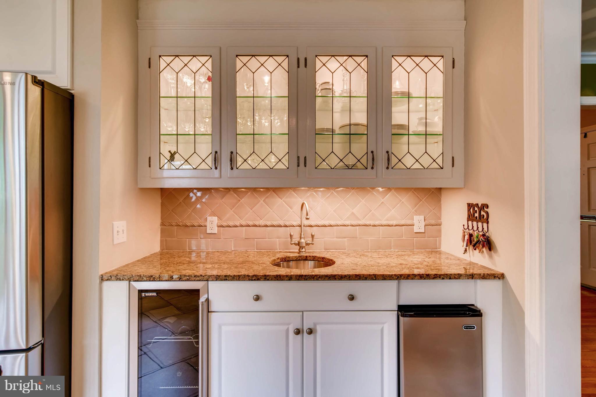 106 Enfield Road Baltimore, MD 21212 - Photo 10 of 27 a kitchen with a sink cabinets and a window
