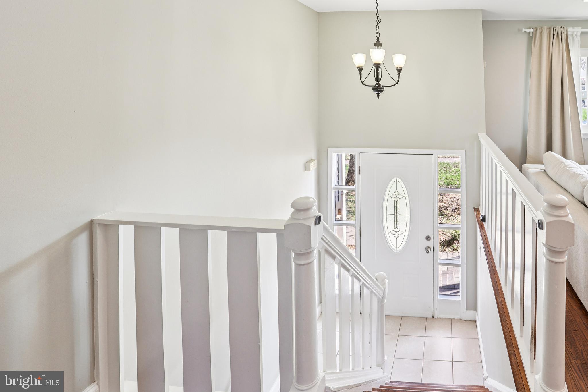 15 Brimfield Road Audubon, PA 19403 - Photo 5 of 41 a view of a hallway with wooden floor and staircase