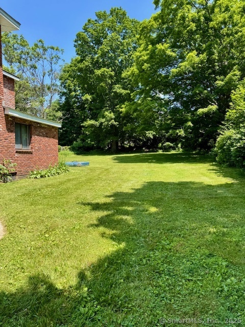 153 Main Street, Unit 2 East Hampton, CT 06424 - Photo 26 of 33 back/side level yard