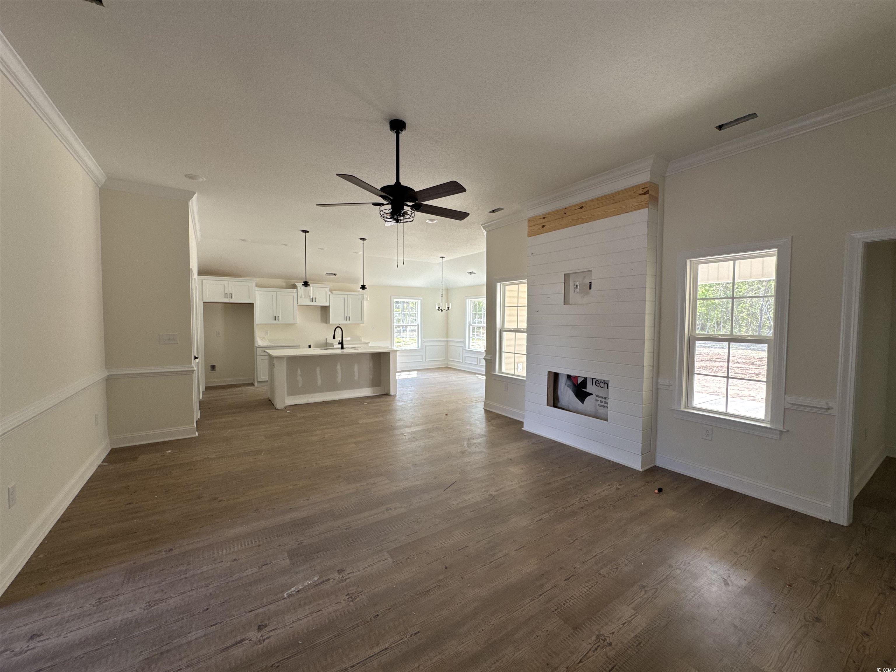 4024 Copperhead Road Conway, SC 29527 - Photo 7 of 15 Unfurnished living room featuring crown molding, a