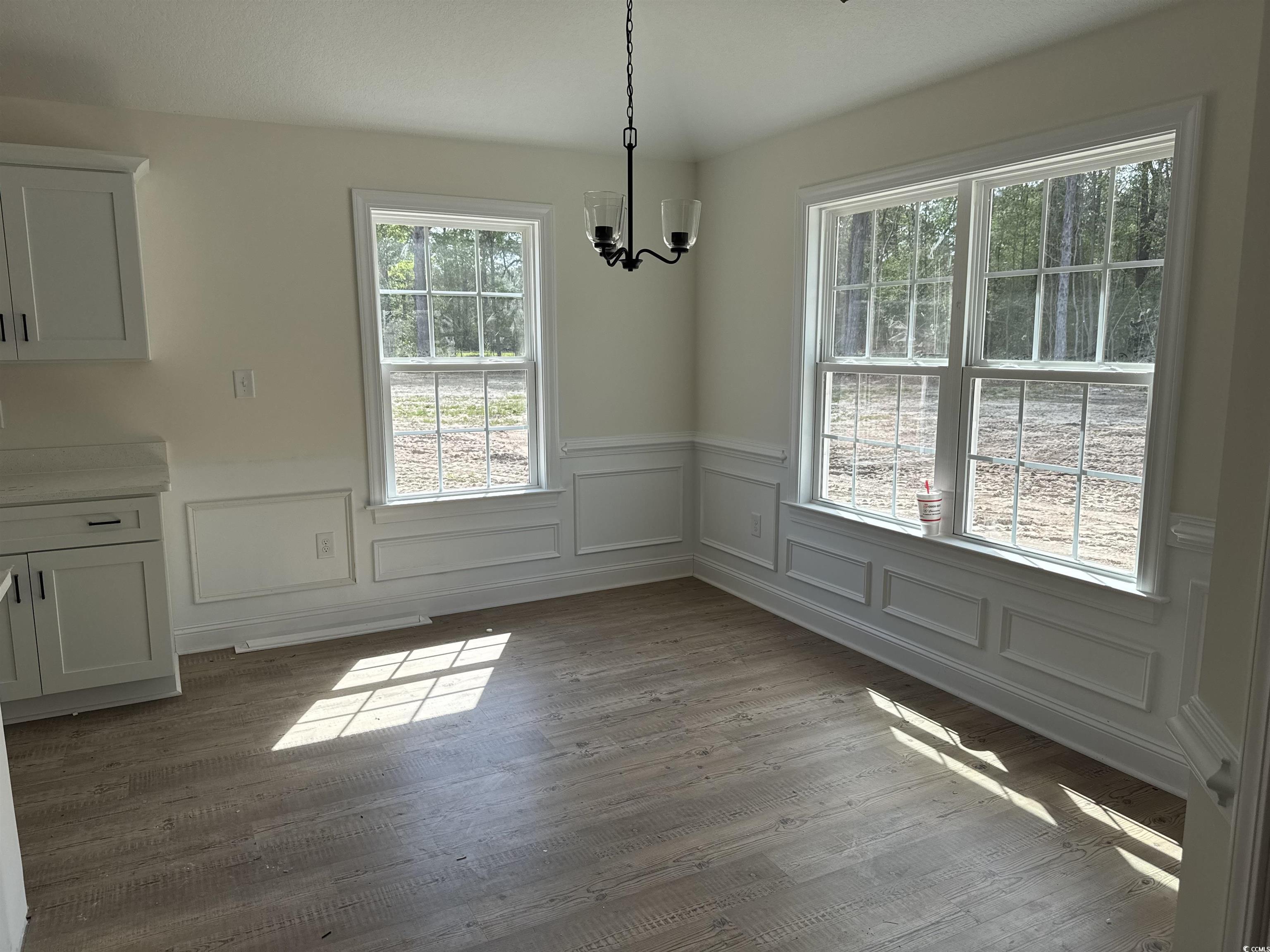 4024 Copperhead Road Conway, SC 29527 - Photo 8 of 15 Unfurnished dining area featuring a wainscoted wal