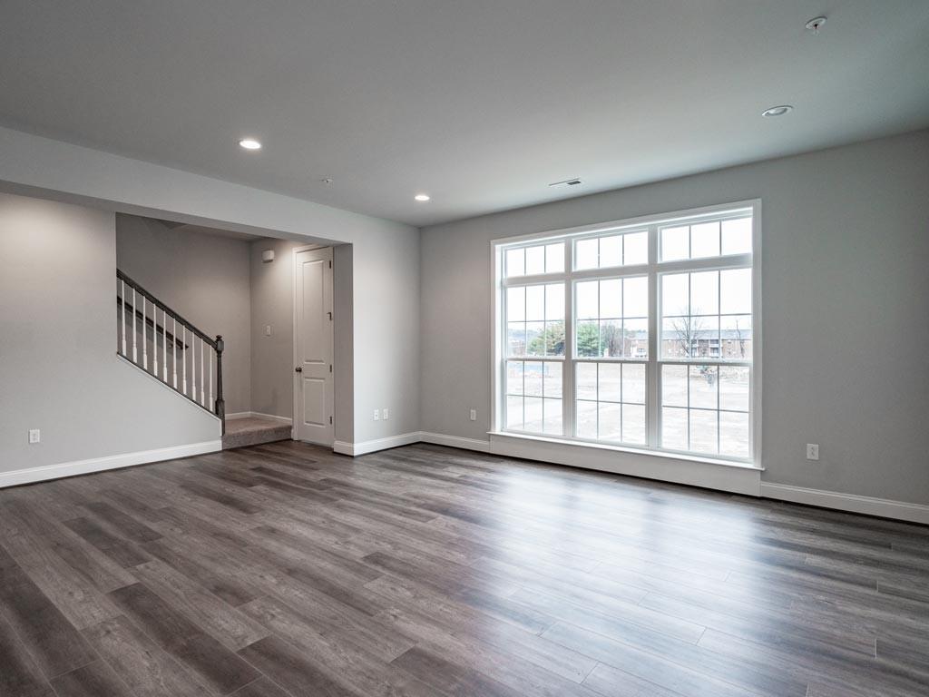 3106 Tulane Way Bridgeville, PA 15017 - Photo 11 of 25 a view of an empty room with wooden floor and a window
