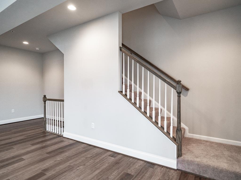 3106 Tulane Way Bridgeville, PA 15017 - Photo 21 of 25 a view of a hallway with wooden floor and stairs