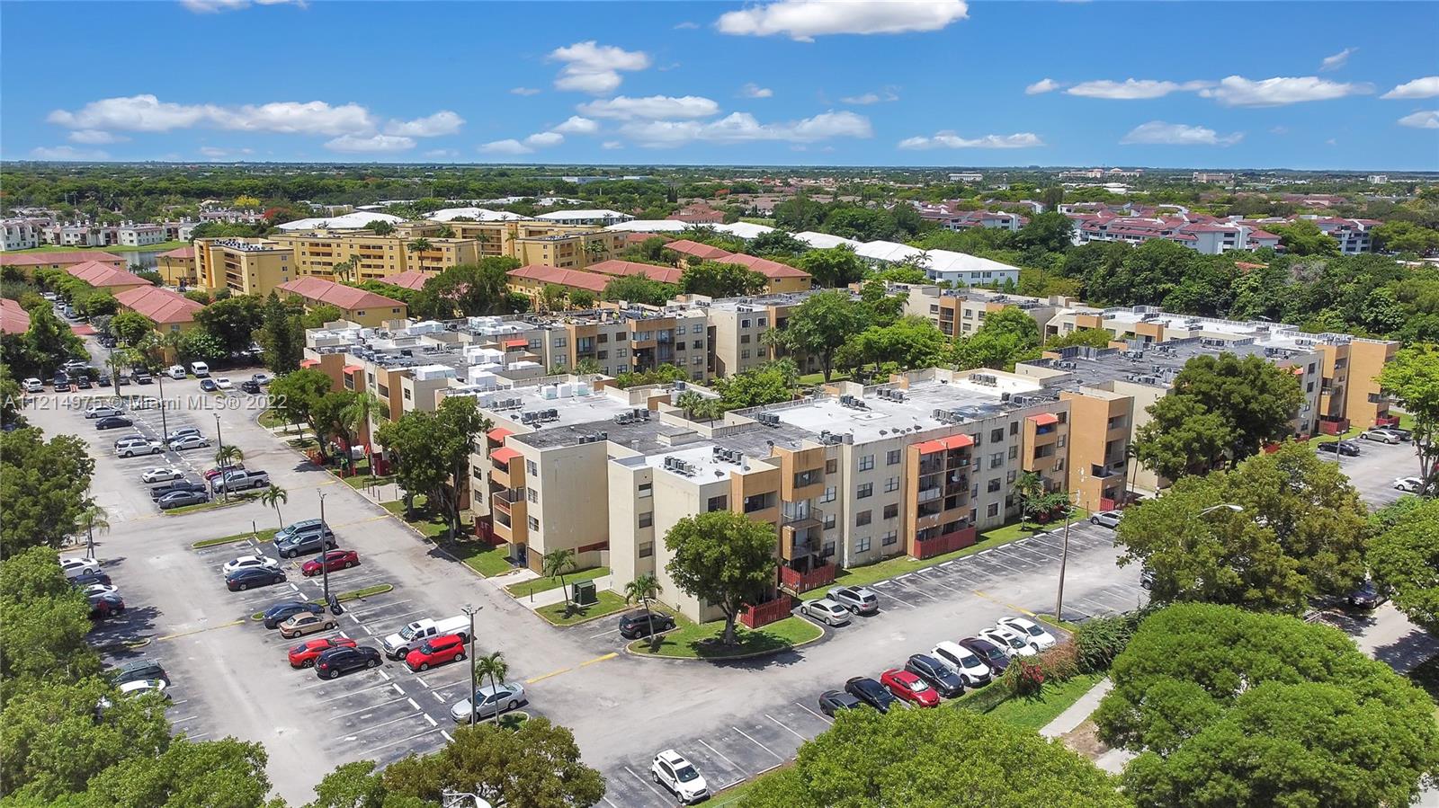 8002 Southwest 149th Avenue, Unit B201 Miami, FL 33193 - Photo 14 of 18 a view of a city with lots of residential buildings ocean and mountain view in back