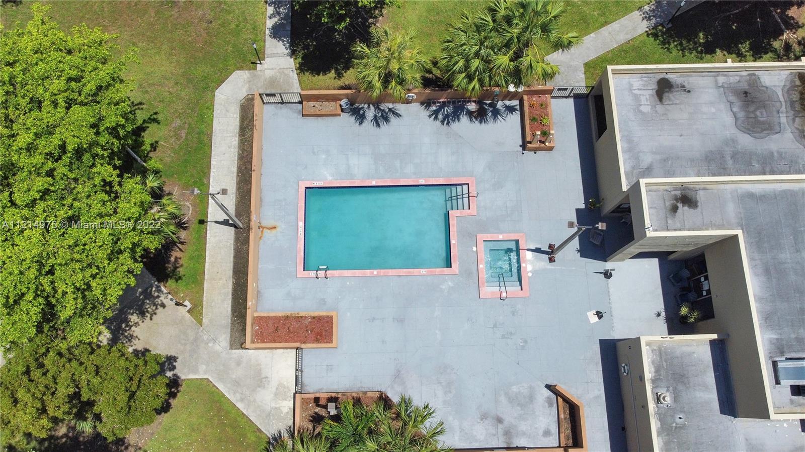 8002 Southwest 149th Avenue, Unit B201 Miami, FL 33193 - Photo 18 of 18 aerial view of a house with pool