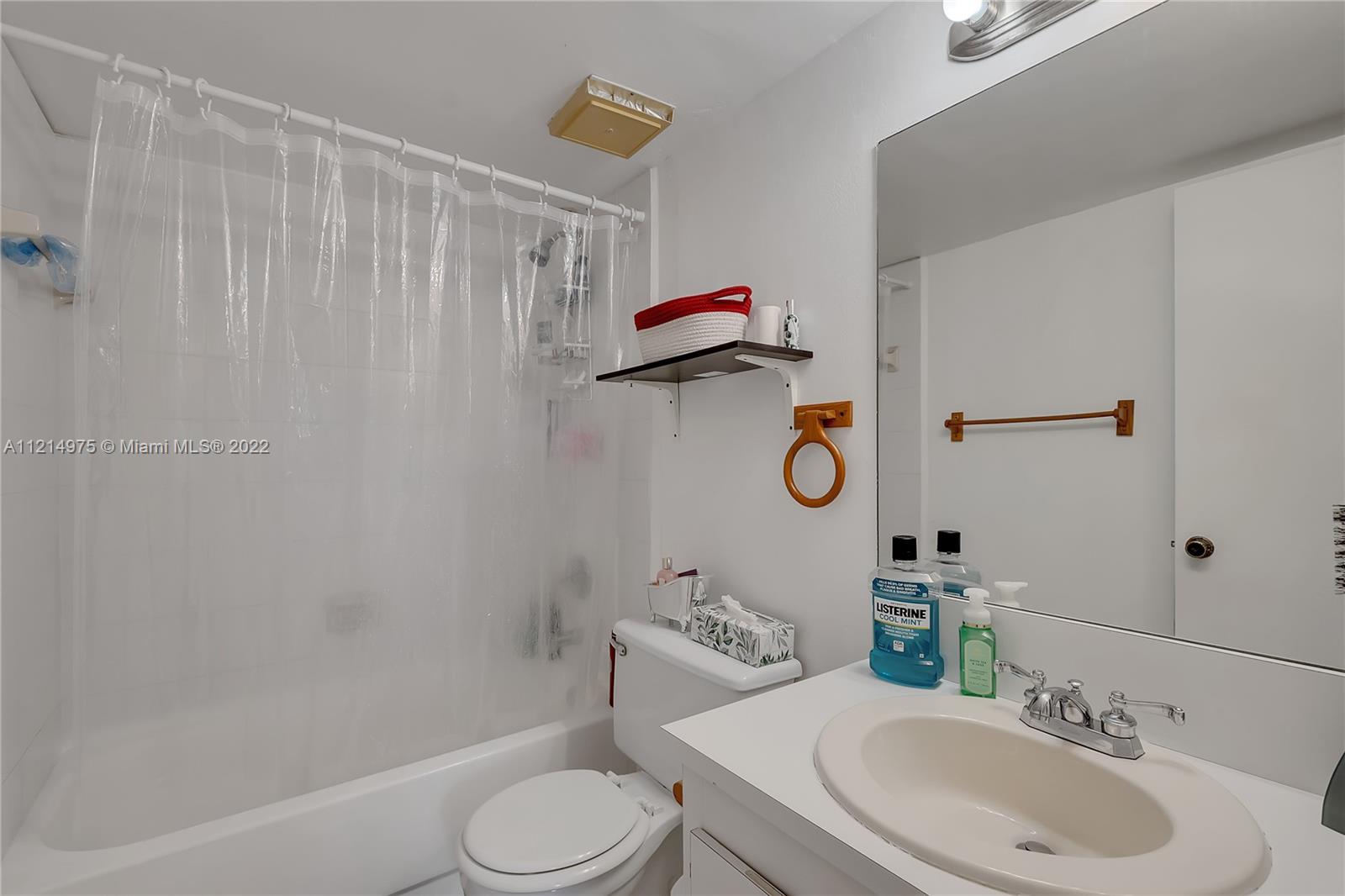 8002 Southwest 149th Avenue, Unit B201 Miami, FL 33193 - Photo 10 of 18 a bathroom with a sink toilet and shower