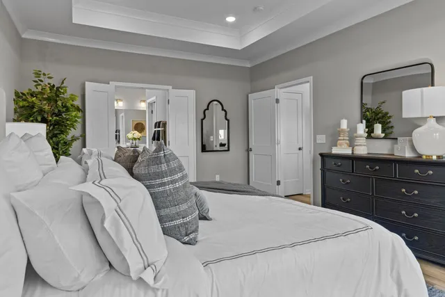 a bed room with a bed and a dresser