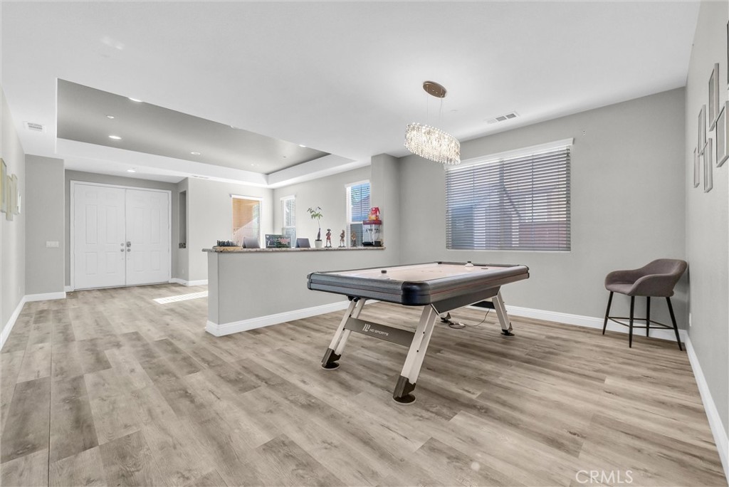 18388 Hidden Ranch Road Riverside, CA 92508 - Photo 10 of 46 a view of a dining room with furniture and wooden floor