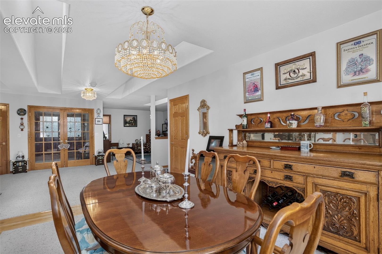 11570 Milford Road Elbert, CO 80106 - Photo 16 of 49 Formal dining area with skylights and access to kitchen.