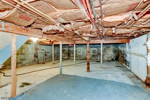 a view of a house with a large tree