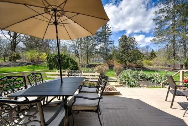 an outdoor space with furniture and umbrella