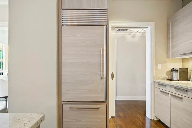 a room with a closet and wooden floor
