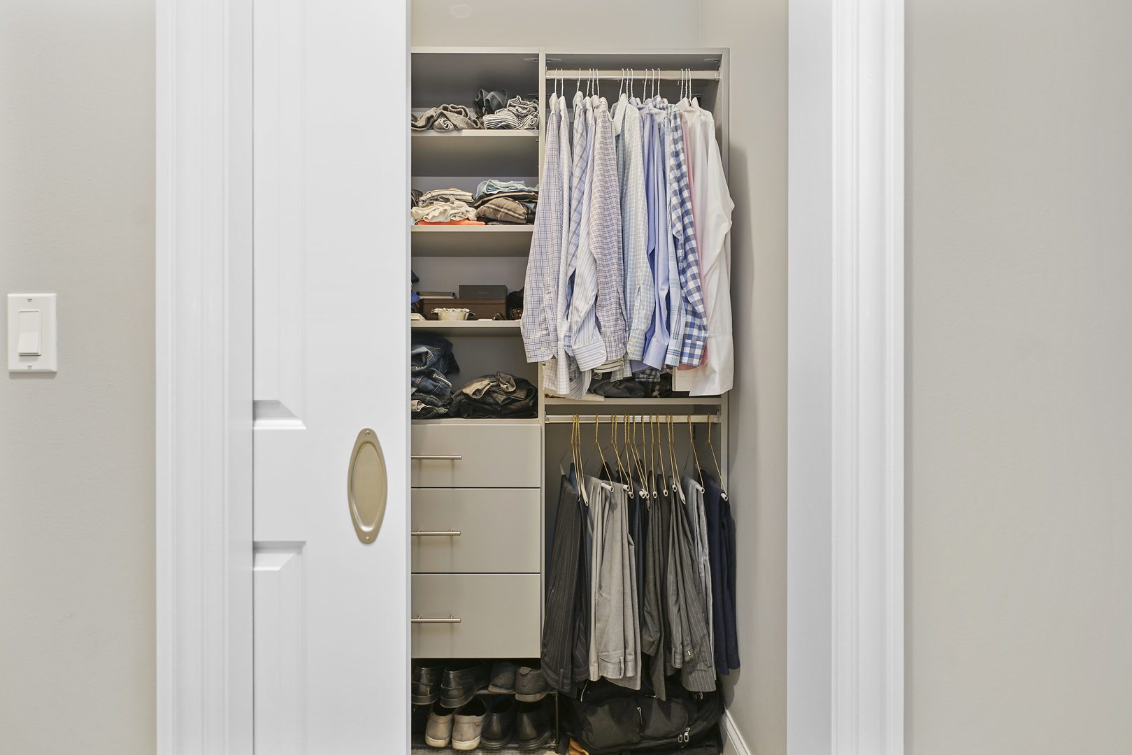 10 East Delaware Place, Unit 18E Chicago, IL 60611 - Photo 26 of 57 a view of walk in closet with clothes and shoes