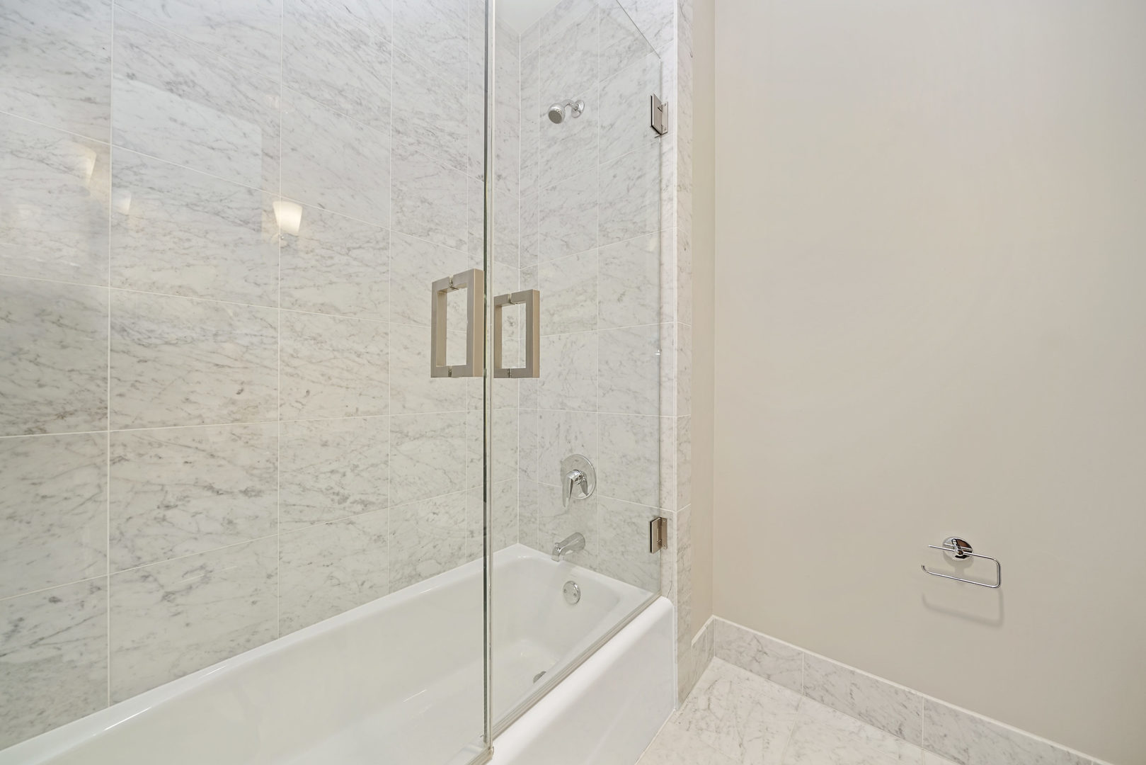 10 East Delaware Place, Unit 18E Chicago, IL 60611 - Photo 33 of 57 a bathroom with a bathtub and shower