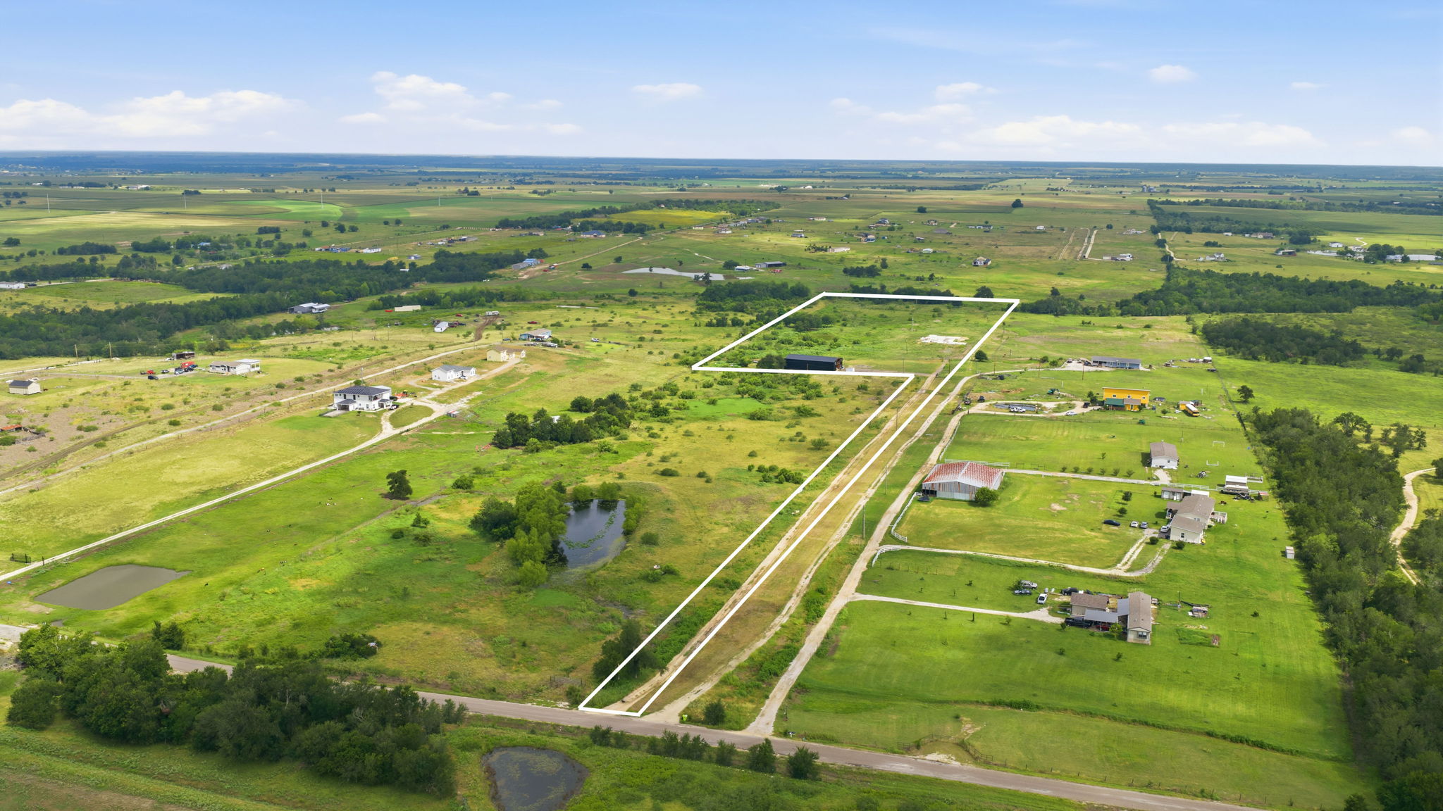 1701 County Road 466 Elgin, TX 78621 - Photo 16 of 24 Vast green acreage offers abundant space for development or private enjoyment.