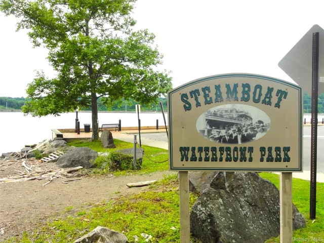 a view of a street with large trees