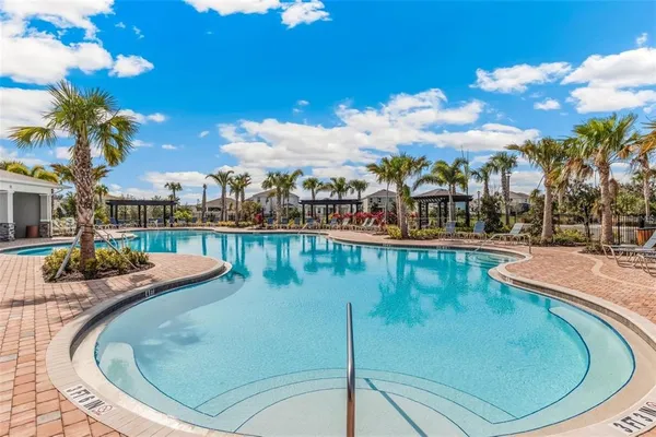 a view of a swimming pool with a lake view