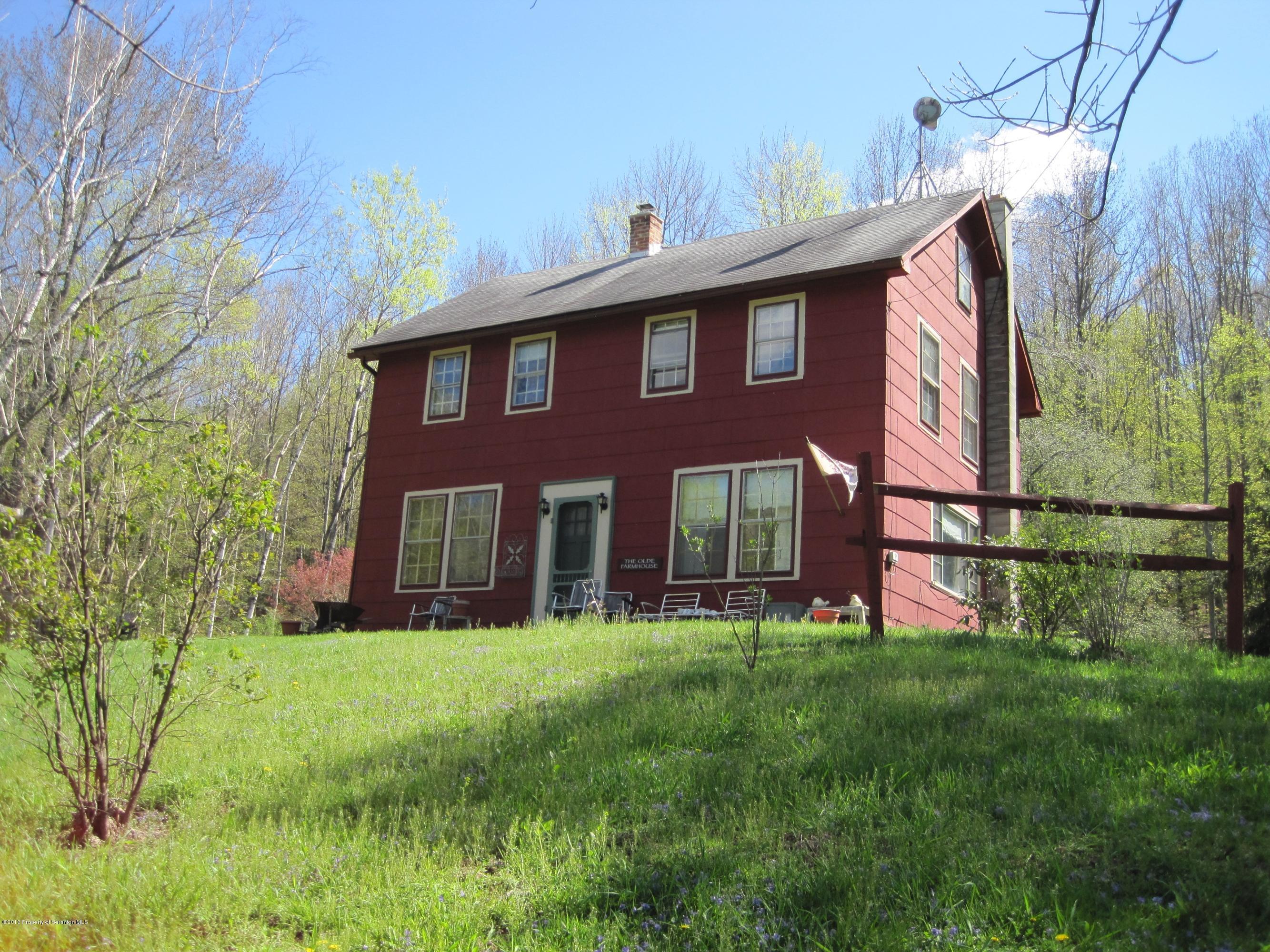 3220 Dimock To Brooklyn Road Kingsley, PA 18826 - Photo 1 of 19 a front view of house with yard and green space