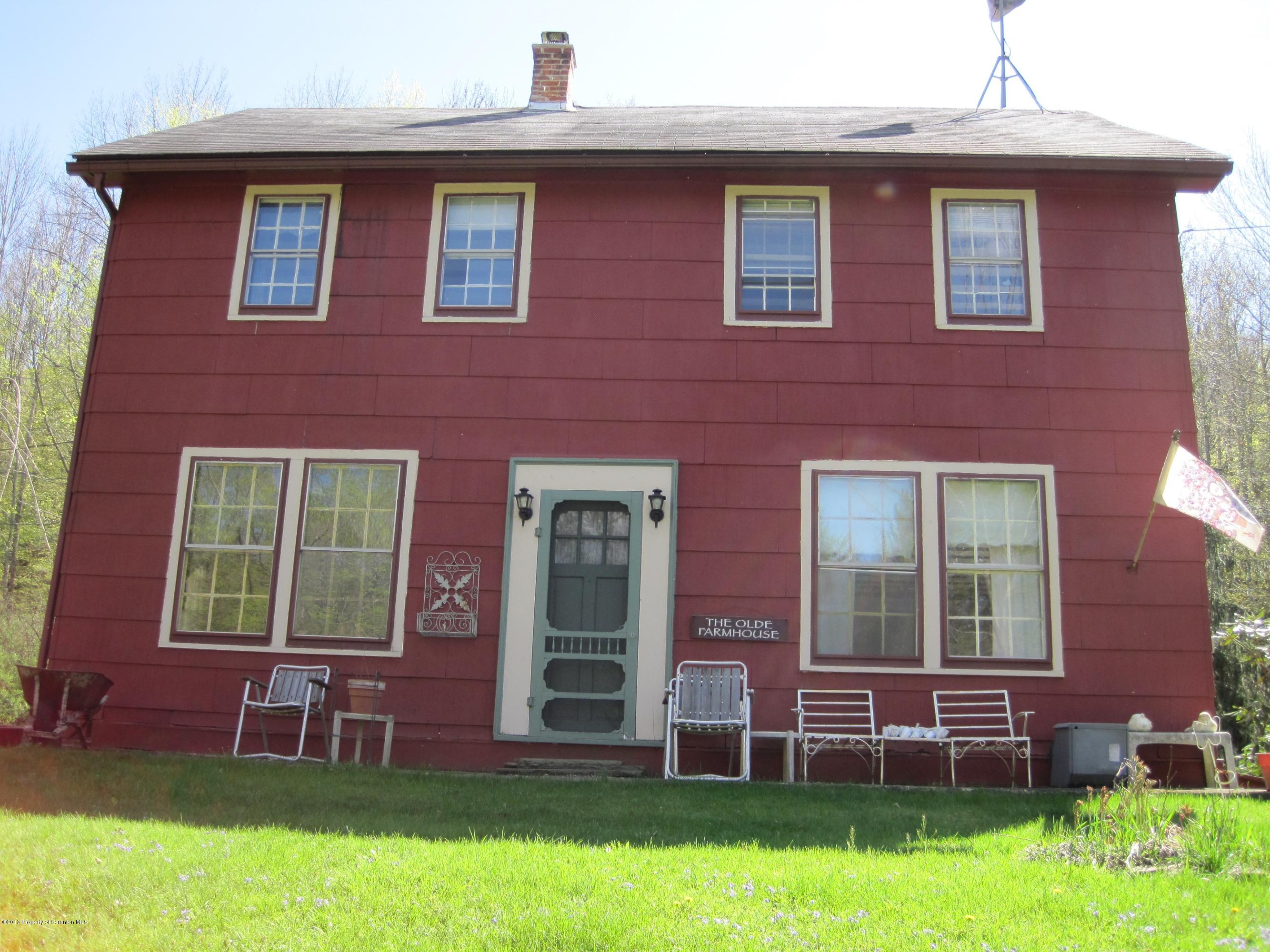 3220 Dimock To Brooklyn Road Kingsley, PA 18826 - Photo 2 of 19 front view of brick house with a yard