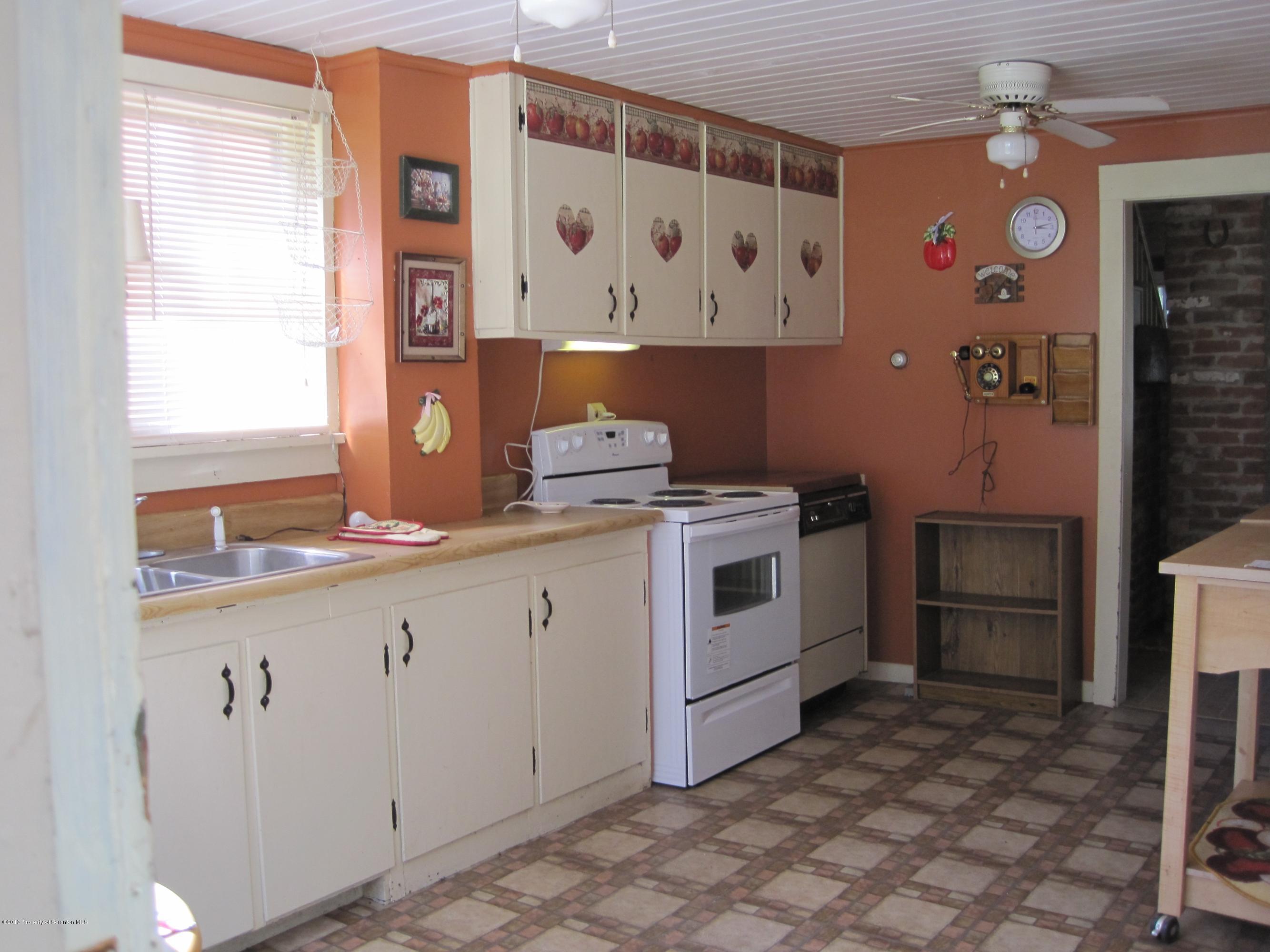 3220 Dimock To Brooklyn Road Kingsley, PA 18826 - Photo 3 of 19 a kitchen with a stove a sink and a refrigerator