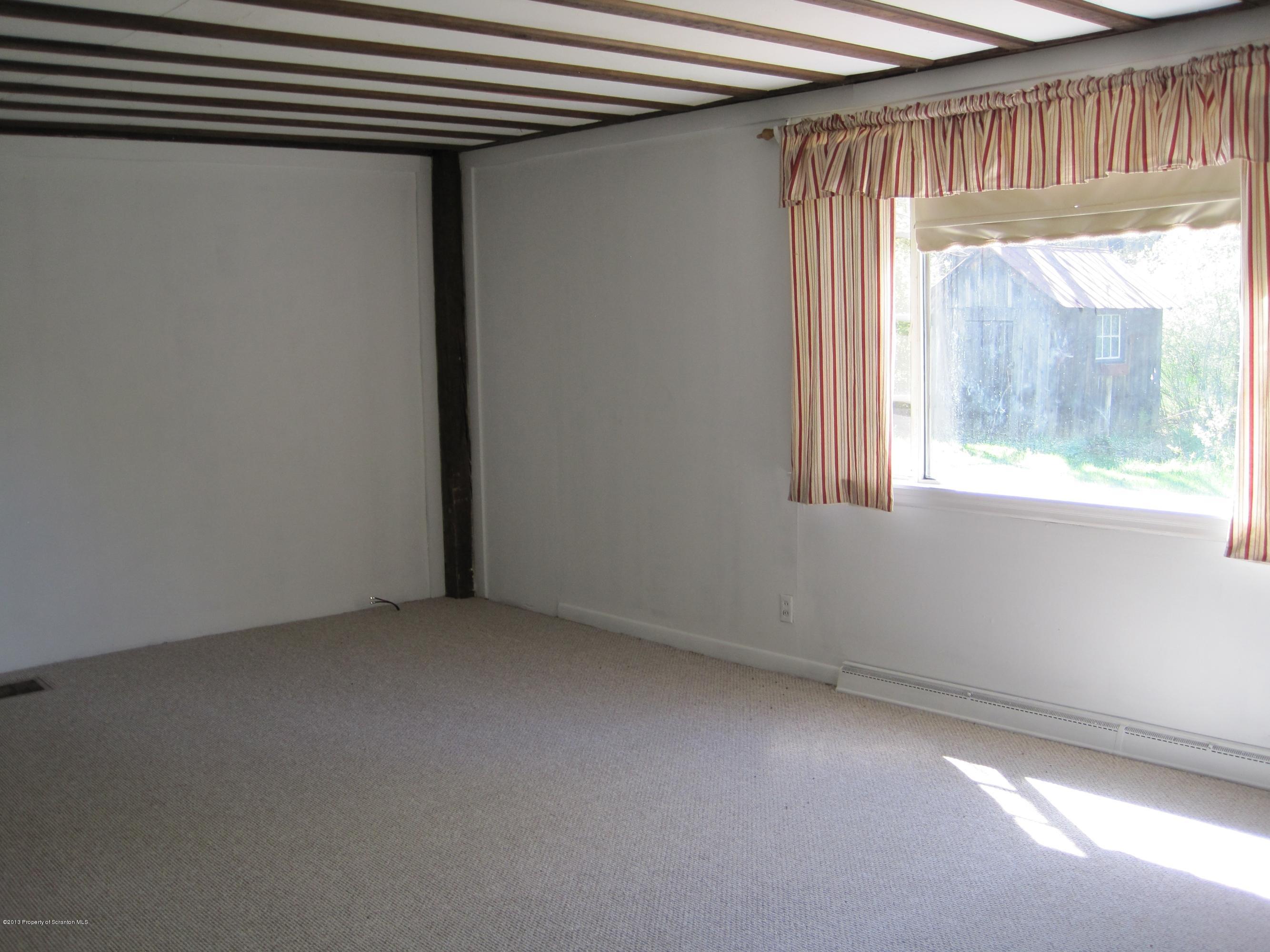 3220 Dimock To Brooklyn Road Kingsley, PA 18826 - Photo 8 of 19 a view of an empty room with a window