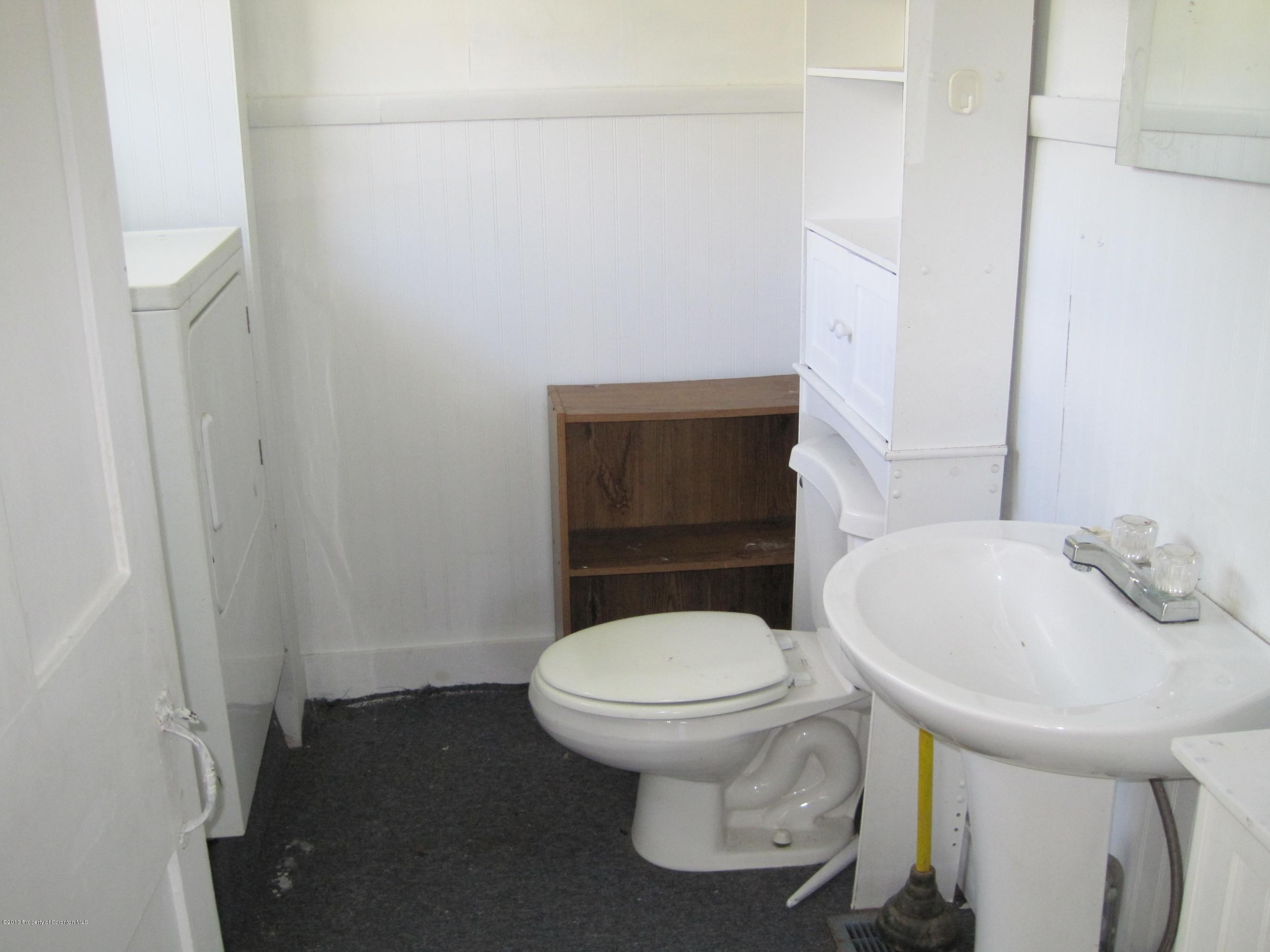 3220 Dimock To Brooklyn Road Kingsley, PA 18826 - Photo 10 of 19 a bathroom with a sink and a toilet