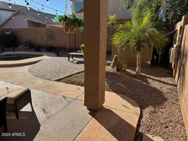 a view of a workspace with furniture and wooden floor