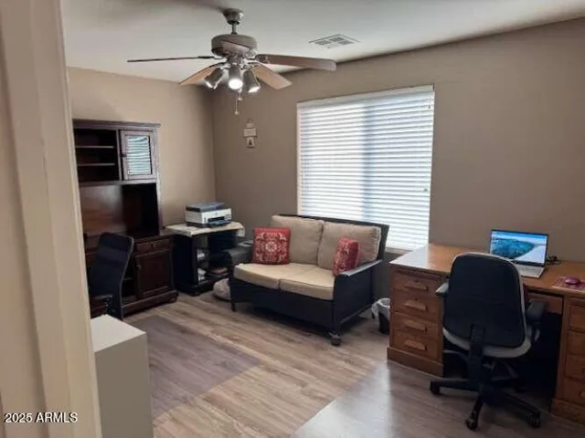 a bathroom with a bathtub and next to a window