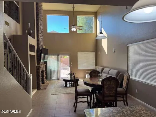 a living room with fireplace furniture and a flat screen tv
