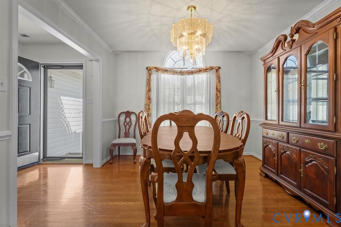 4319 Stately Oak Road North Chesterfield, VA 23234 - Photo 6 of 51 Wood-finish flooring, crown molding, and a decorat