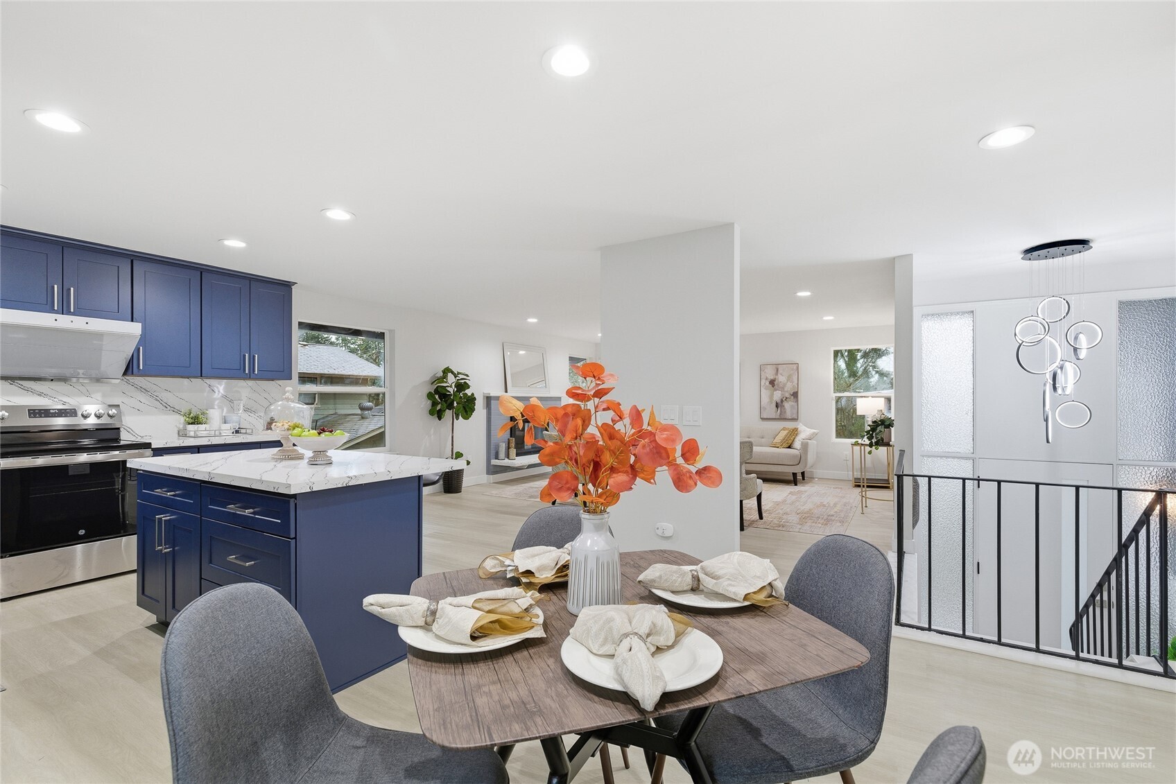 4426 Northeast 17th Street Renton, WA 98059 - Photo 13 of 36 a open dining room with furniture a table and kitchen view